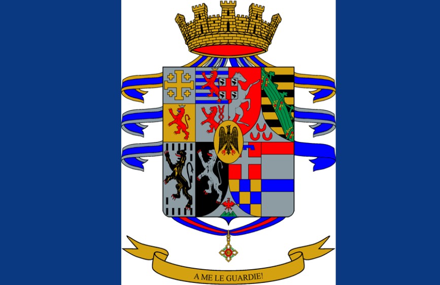 Stemma araldico composto da più scudi nobiliari, sormontato da una corona muraria dorata. Nastro dorato in basso con il motto 'A ME LE GUARDIE!