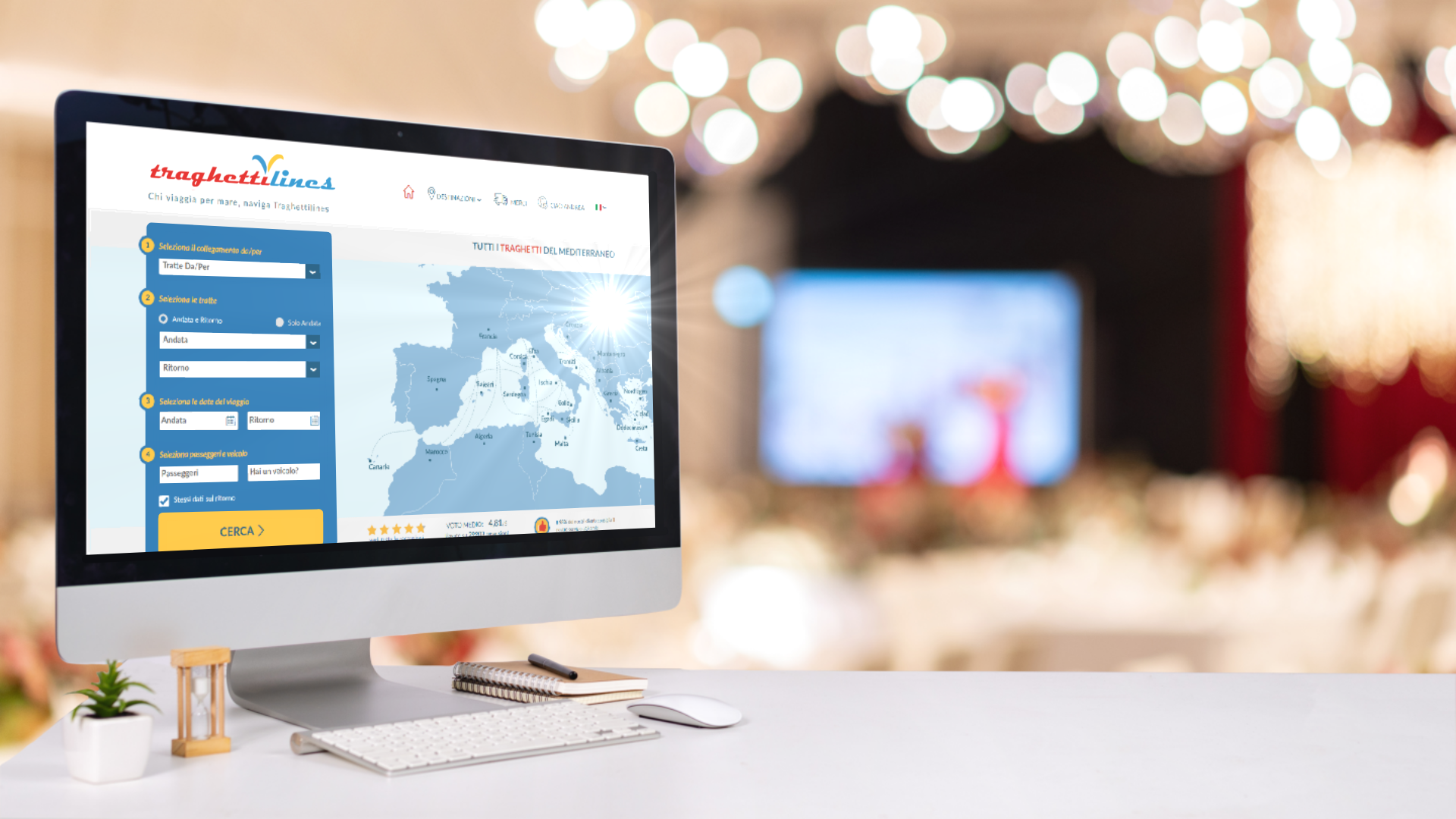 Su una scrivania ordinata è visibile lo schermo di un computer che mostra la homepage del sito TraghettiLines. L’immagine è stata creata per promuovere la partnership con la Lega del Filo d'Oro.