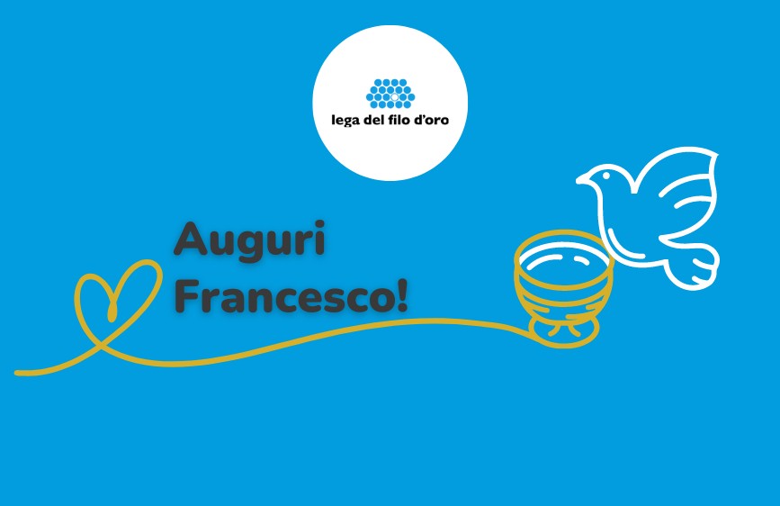 L'immagine mostra un biglietto di auguri su sfondo blu brillante con il logo della "Lega del Filo d'Oro" in un cerchio bianco in alto. Al centro, in lettere marroni, si legge "Auguri Francesco!", con una linea stilizzata gialla che parte da un cuore a sinistra, si connette a una tazza dorata e si estende verso una colomba bianca stilizzata a destra.